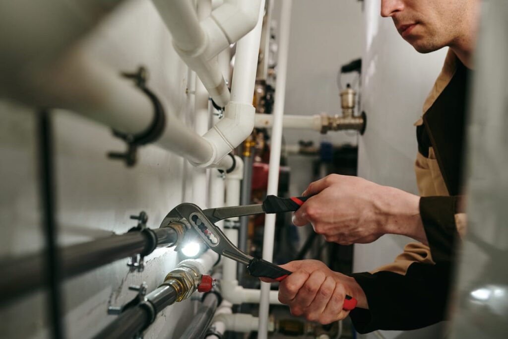 Plumbers maintaining commercial plumbing pipes in Casselberry