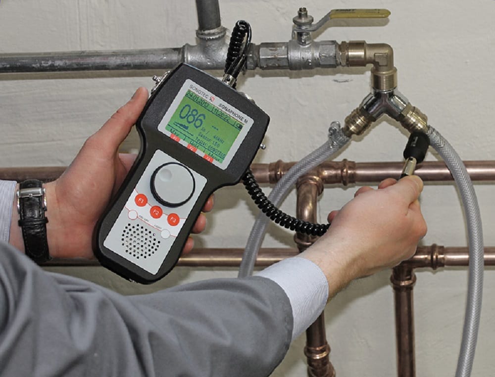 Plumber testing pipes with electronic leak detection equipment in Casselberry