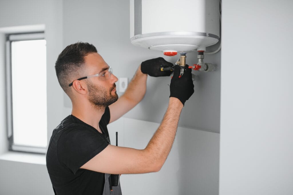 Technician performing water heater maintenance in Casselberry