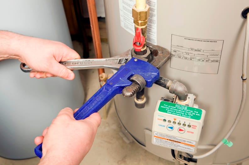 Plumber repairing a water heater valve in Casselberry